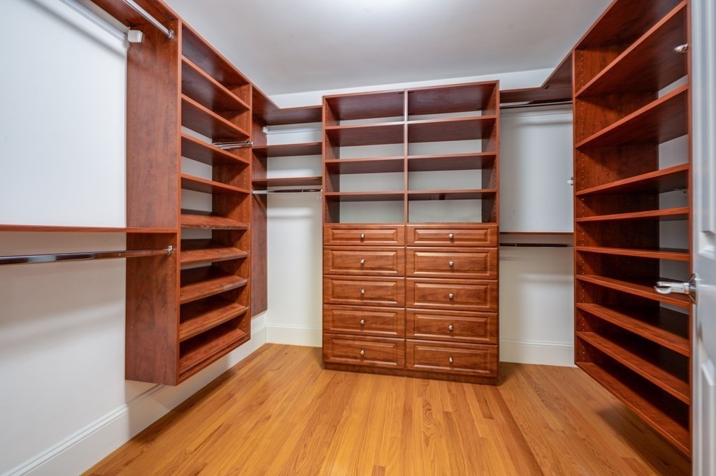 50 Barrett Street Needham, MA 02492 - Photo 19 of 32 a view of walk in closet with empty racks
