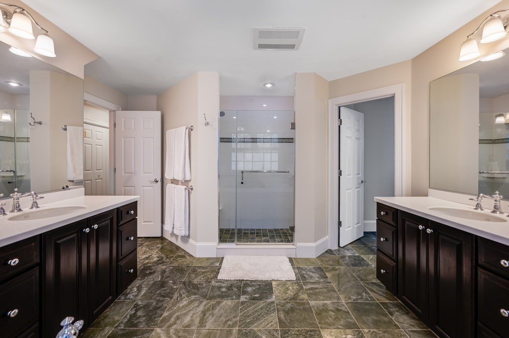 50 Barrett Street Needham, MA 02492 - Photo 20 of 32 a bathroom with a double vanity sink and a mirror