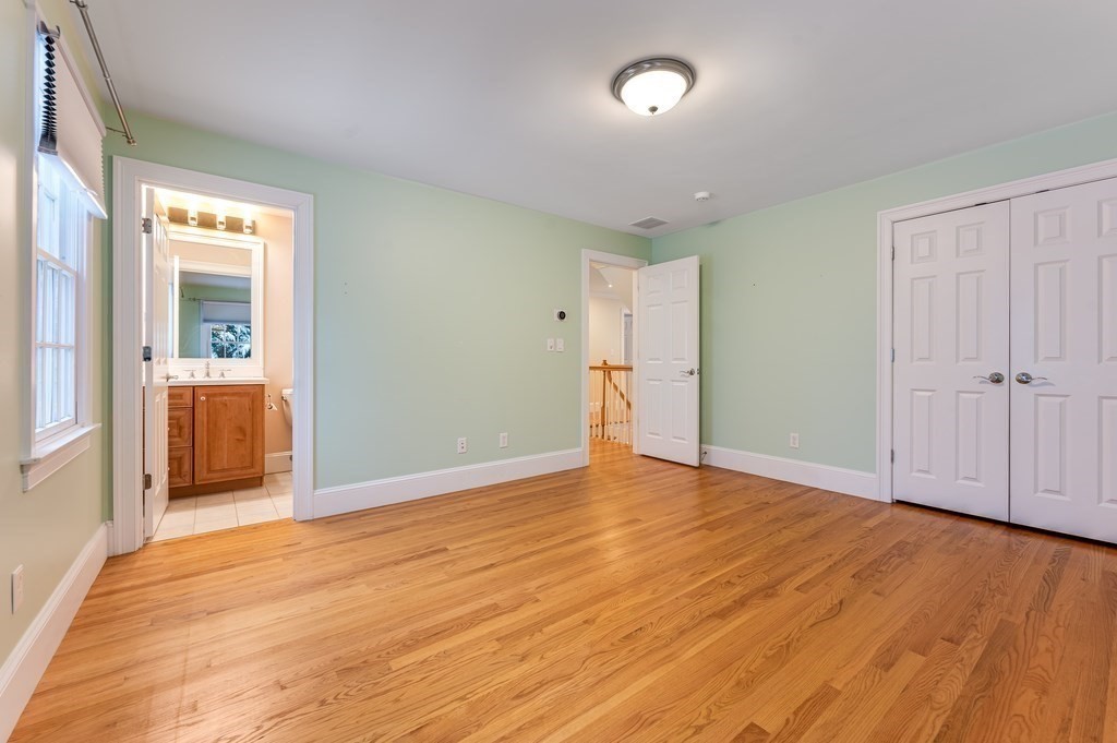 50 Barrett Street Needham, MA 02492 - Photo 22 of 32 a view of an empty room with wooden floor and a window