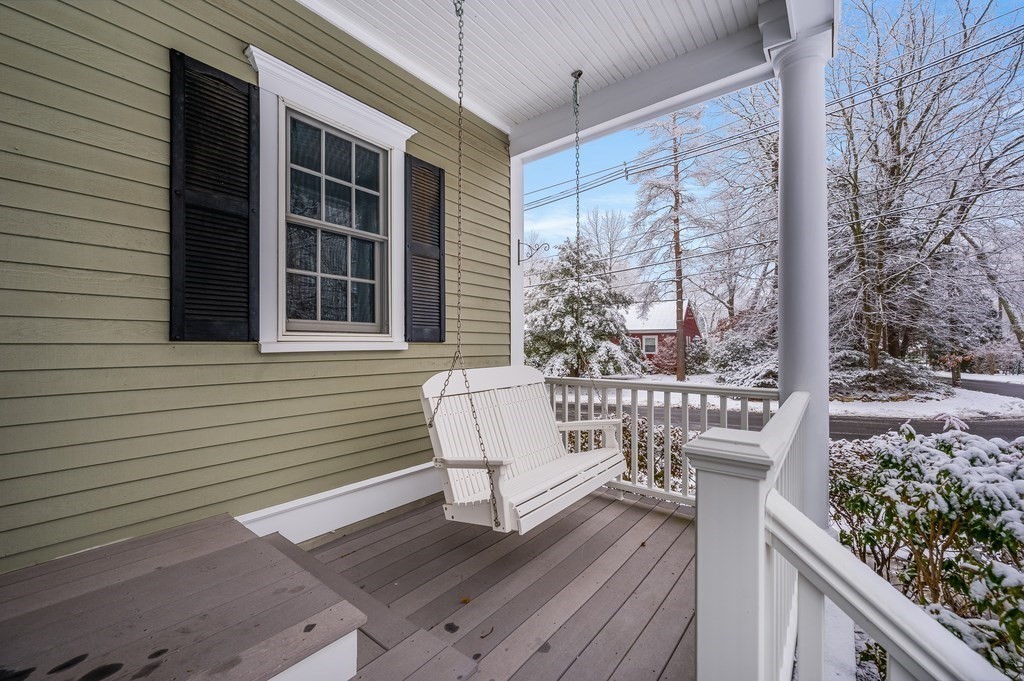 50 Barrett Street Needham, MA 02492 - Photo 27 of 32 a view of a deck with furniture and next to a yard