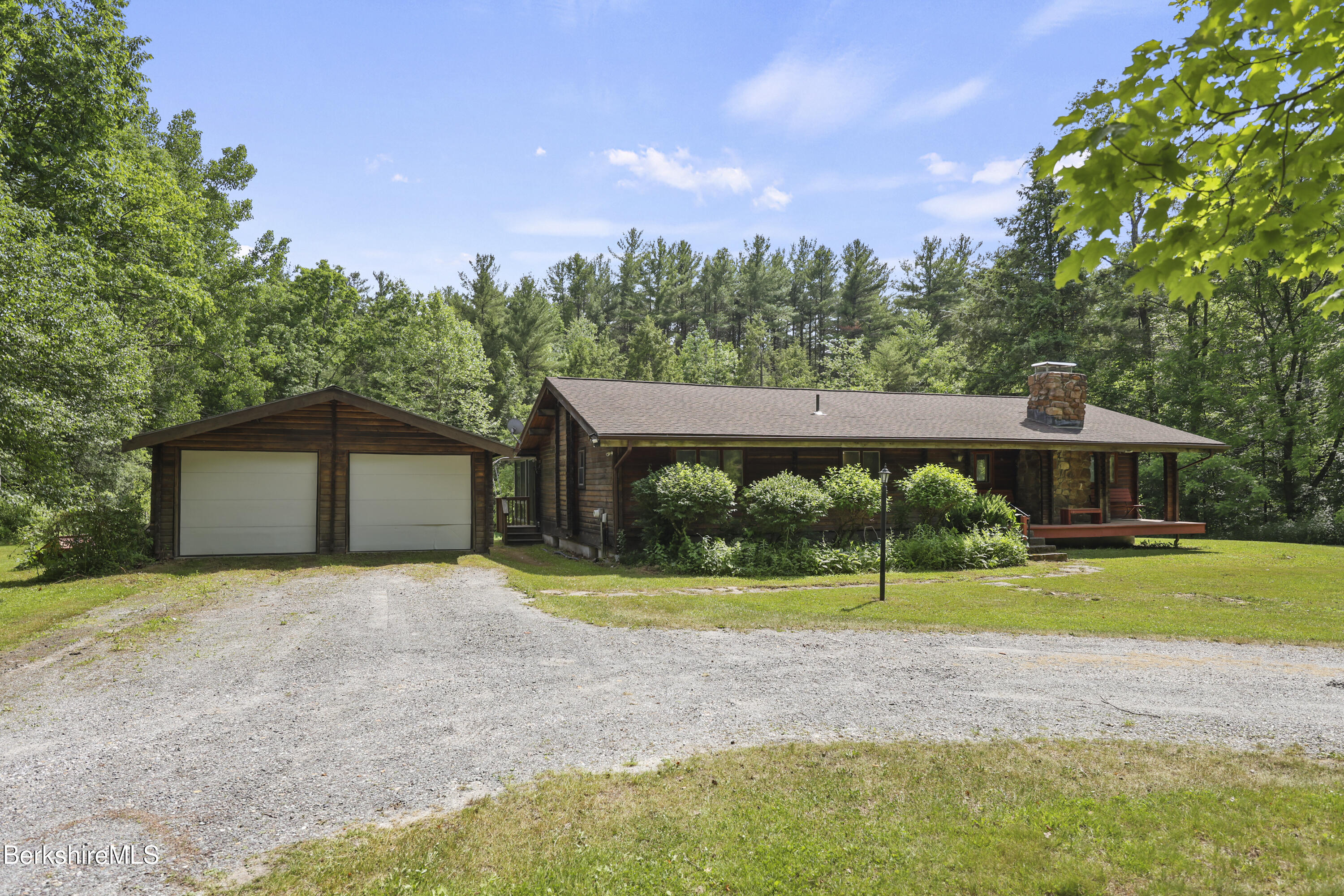 240 Kirchner Road Dalton, MA 01226 - Photo 9 of 51 a front view of a house with a yard and garage