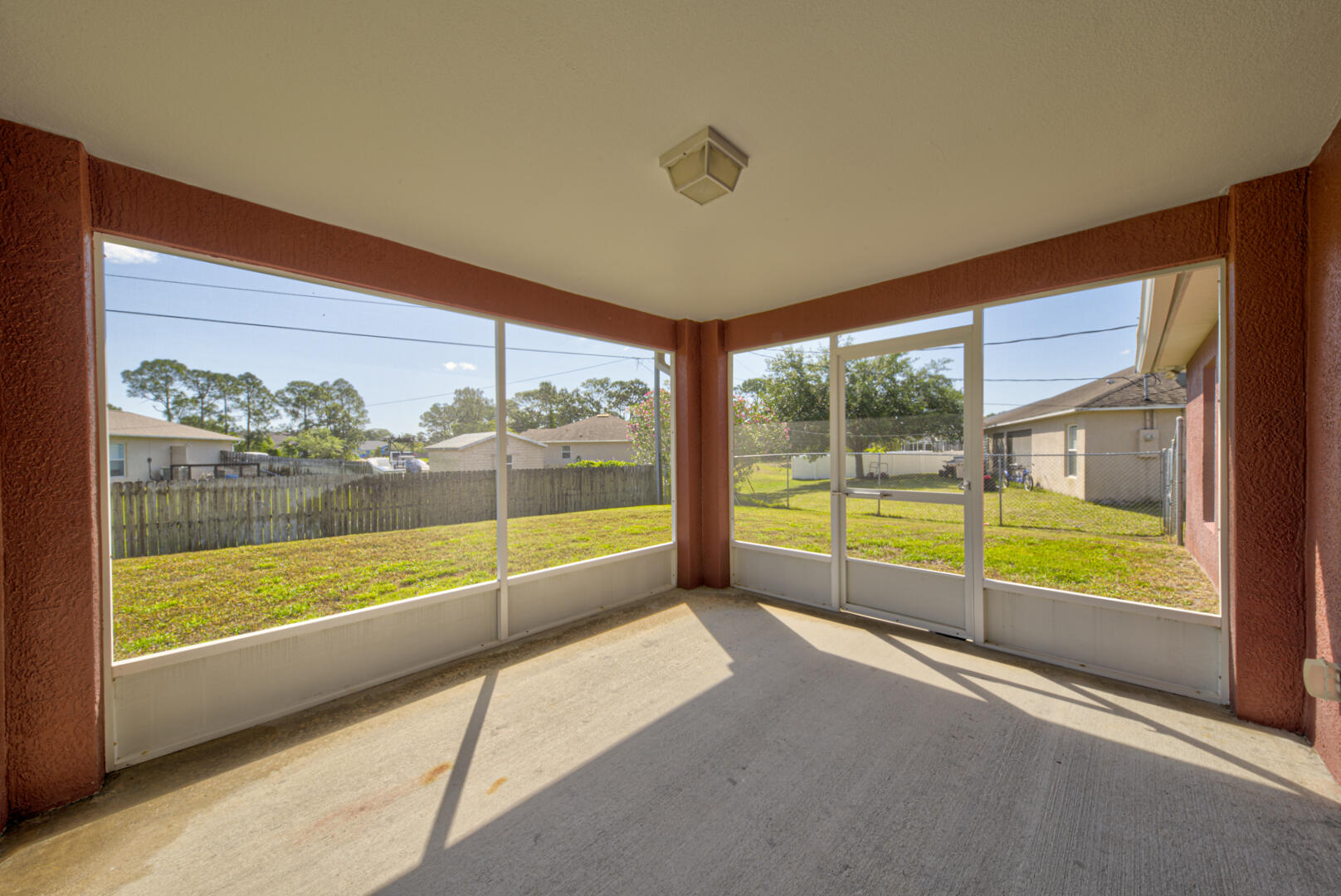 1453 Goyer Road Southeast Palm Bay, FL 32909 - Photo 37 of 41 screened-in back porch