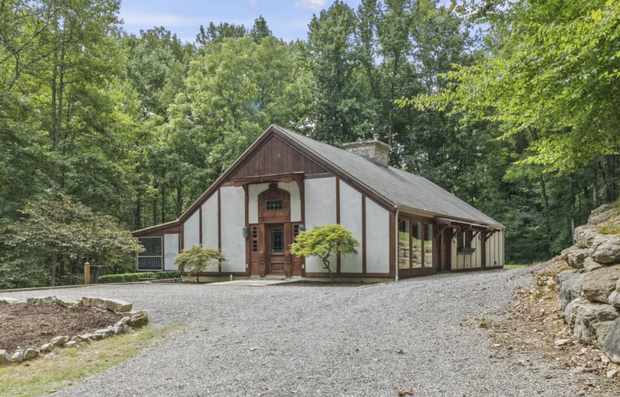 a front view of a house with garden