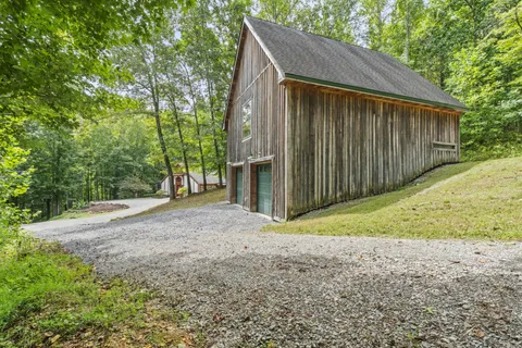an aerial view of a house with yard
