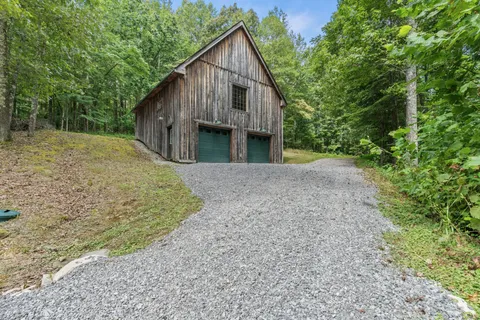 a view of a porch with wooden floor