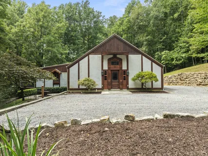 a house with trees in the background