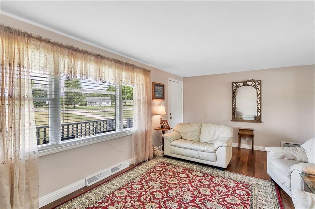 1201 Prospect Road Evans City, PA 16033 - Photo 15 of 45 a living room with furniture and a large window