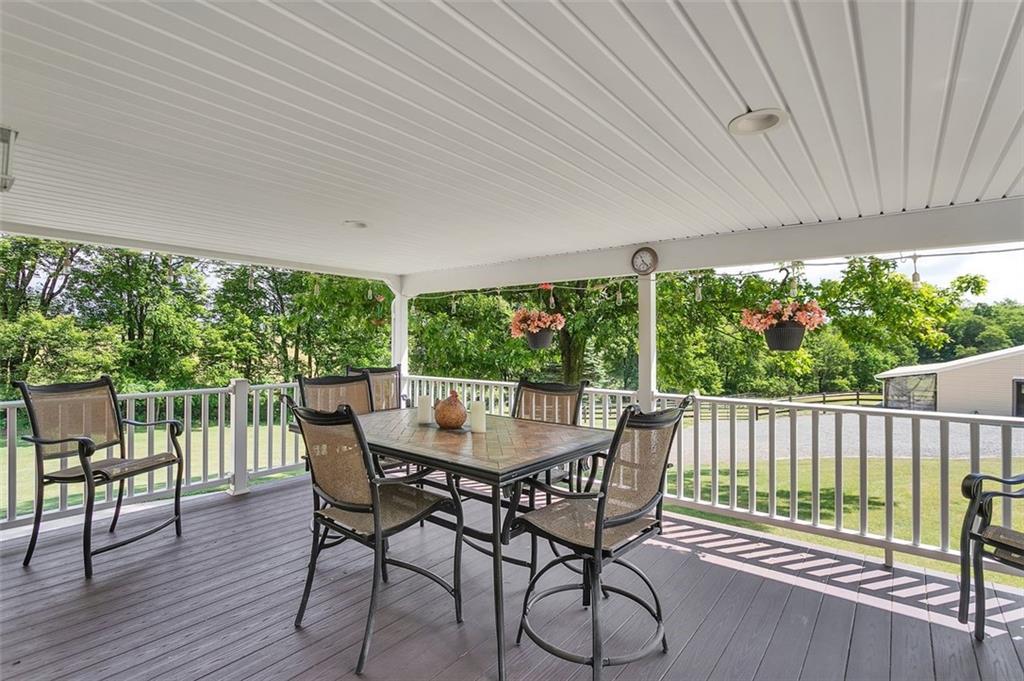 1201 Prospect Road Evans City, PA 16033 - Photo 18 of 45 a view of a patio with a table chairs and backyard