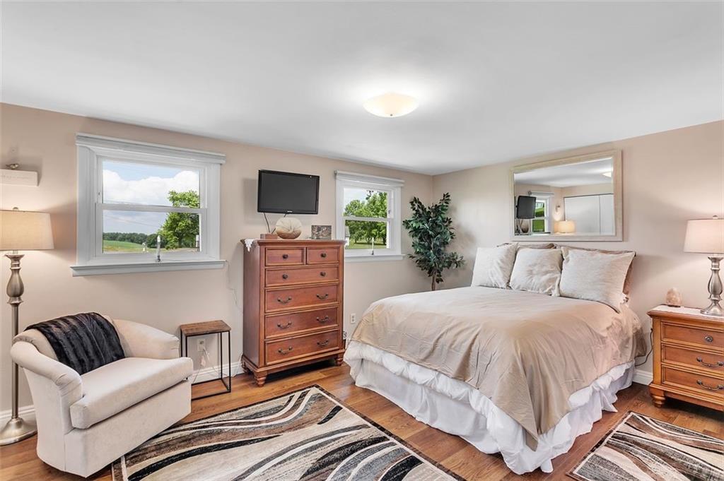 1201 Prospect Road Evans City, PA 16033 - Photo 22 of 45 a bedroom with a bed and a couch