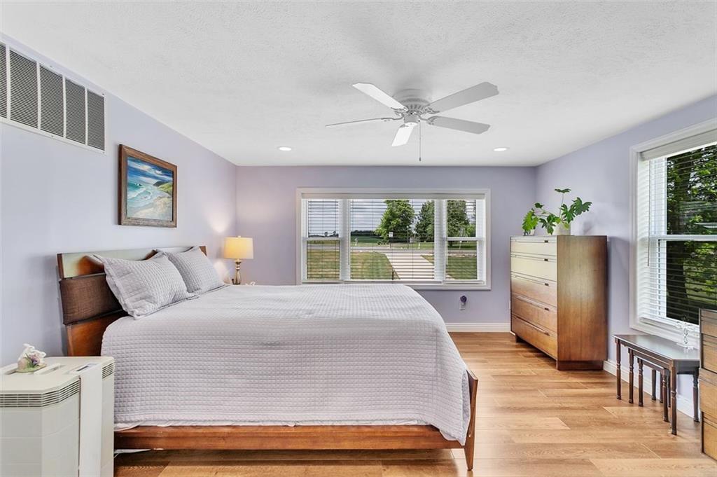 1201 Prospect Road Evans City, PA 16033 - Photo 23 of 45 a spacious bedroom with a large bed and a window