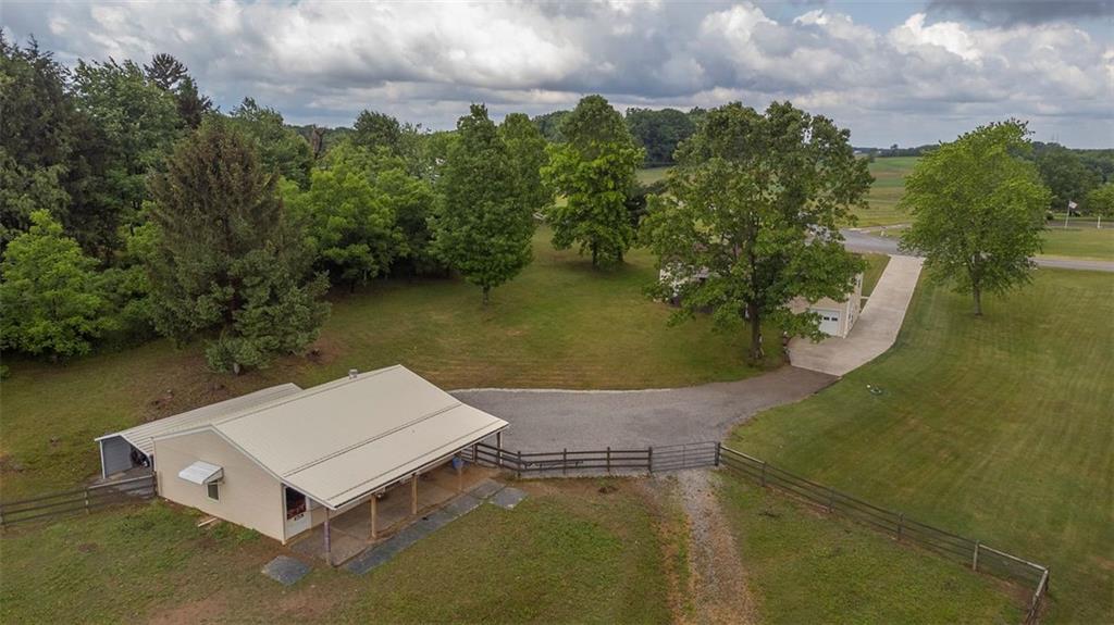 1201 Prospect Road Evans City, PA 16033 - Photo 30 of 45 an aerial view of a house with a yard and lake view