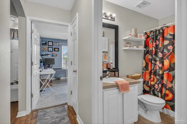 a living room with furniture a rug and a window
