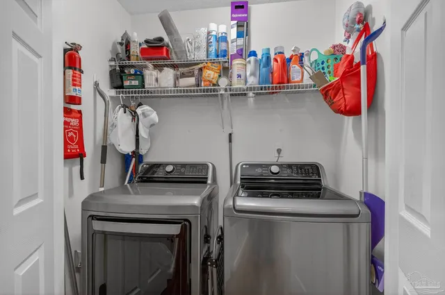 a kitchen with granite countertop a refrigerator stove and sink