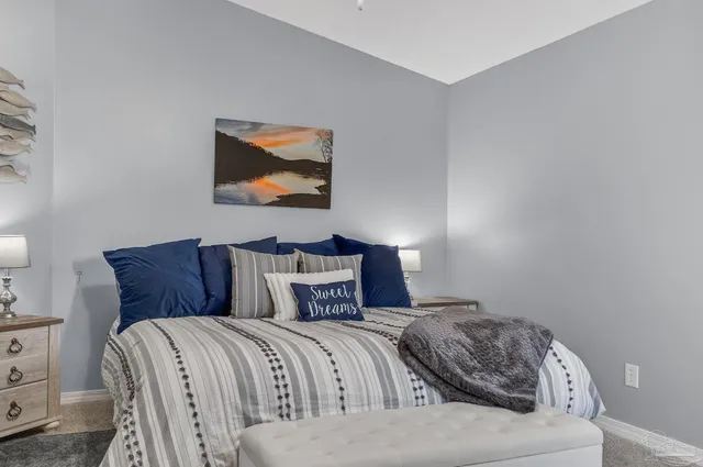 a spacious bathroom with a granite countertop sink and a mirror