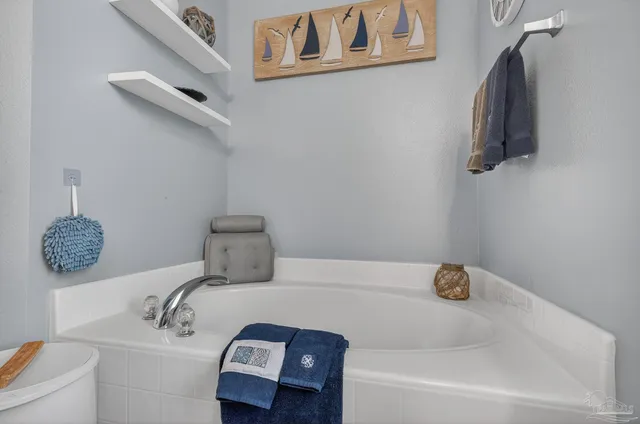 a kitchen with a sink and a refrigerator