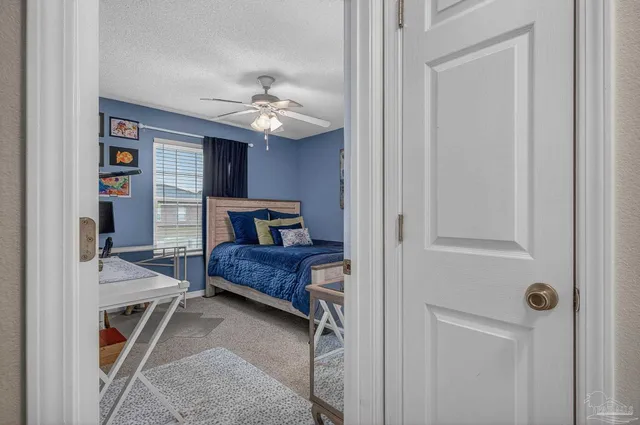 a bedroom with bed and window