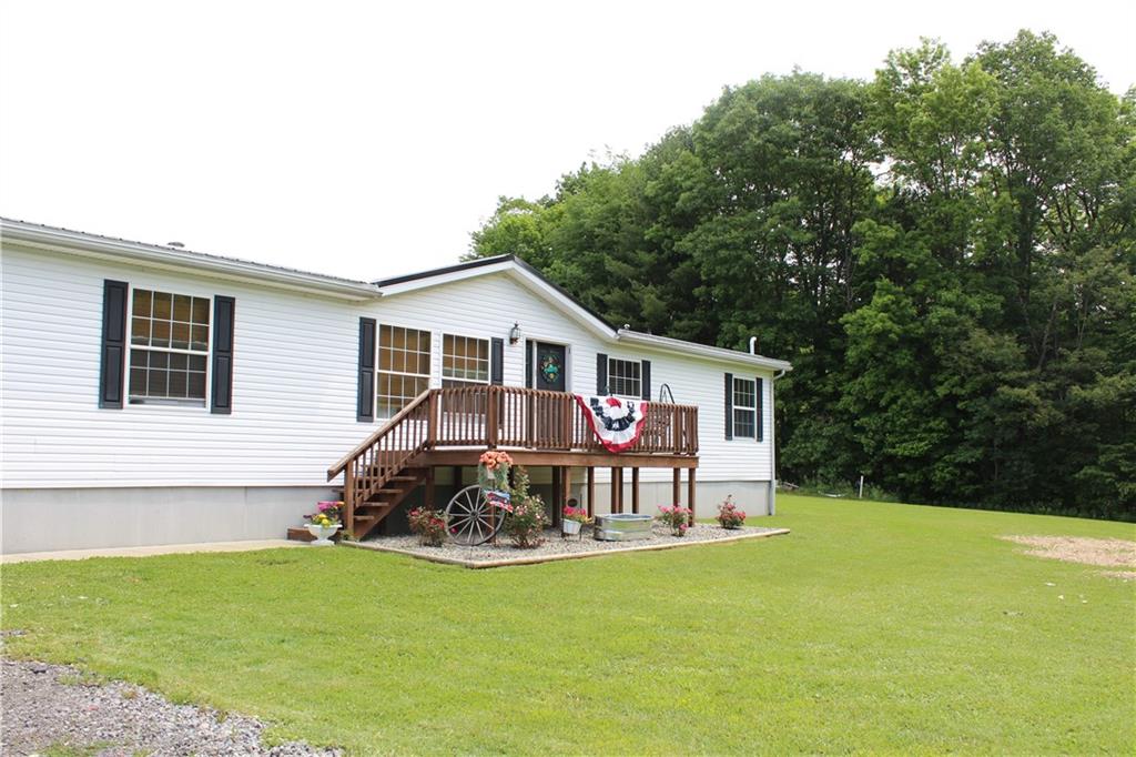 239 Smola Road Sandy Lake, PA 16145 - Photo 34 of 34 a view of a house with backyard and garden