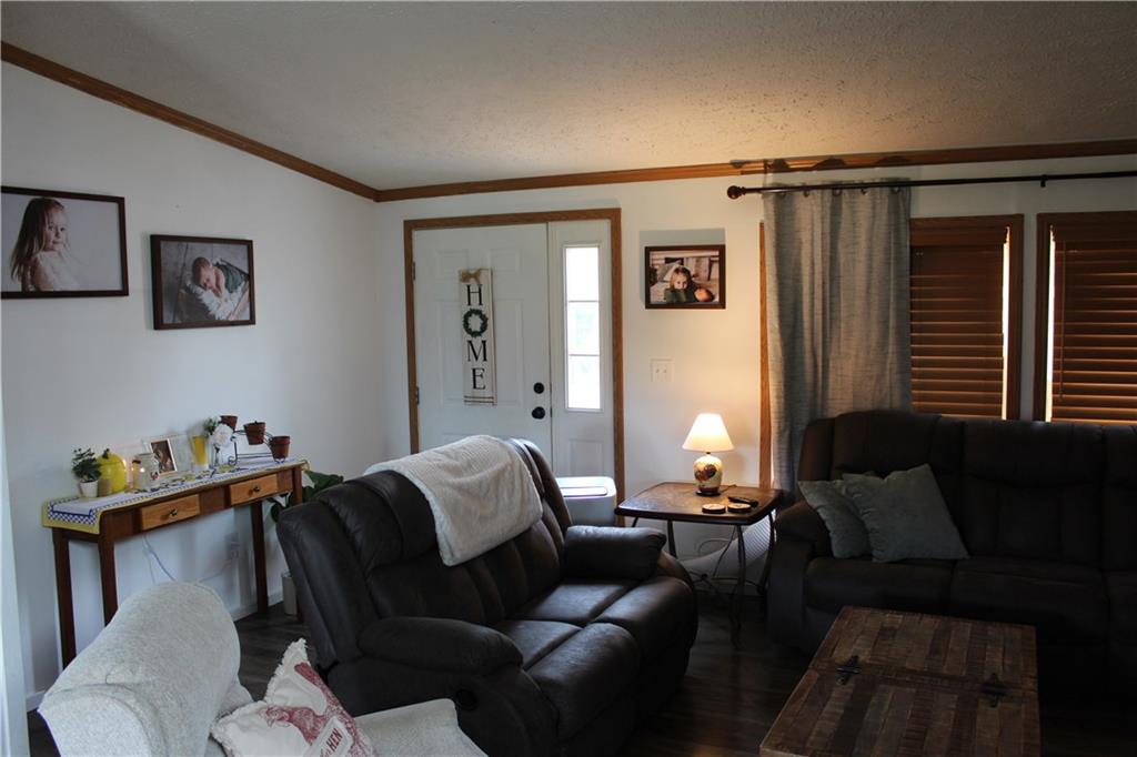 239 Smola Road Sandy Lake, PA 16145 - Photo 8 of 34 a living room with furniture and a window