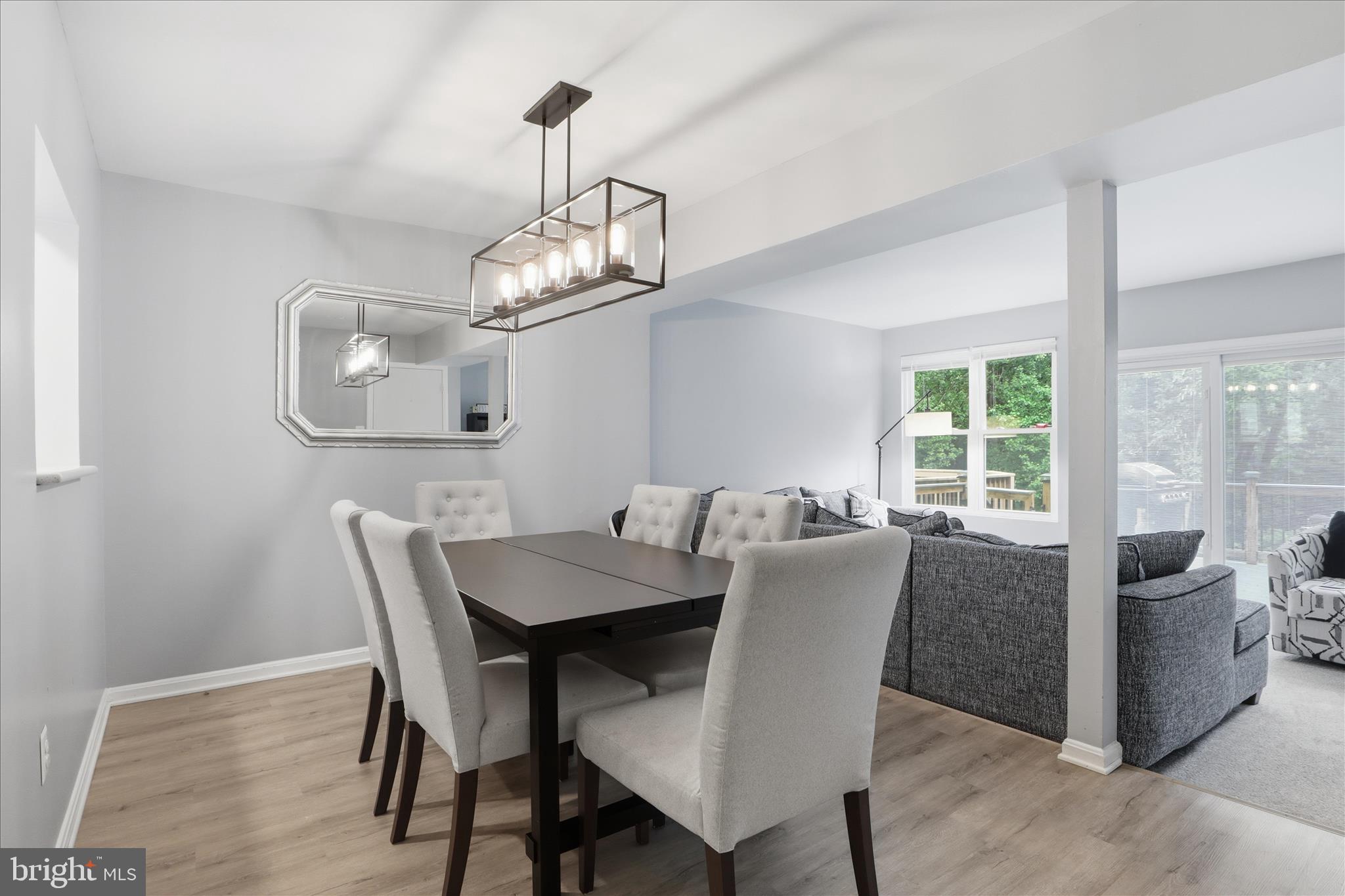 71 Kinsman View Circle Silver Spring, MD 20901 - Photo 6 of 42 a view of a dining room with furniture wooden floor and chandelier