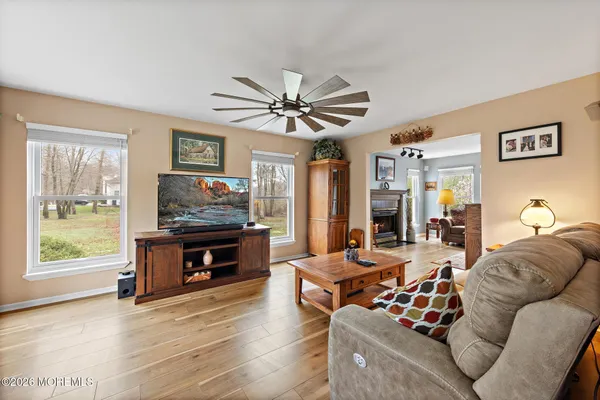 a living room with furniture and a fireplace