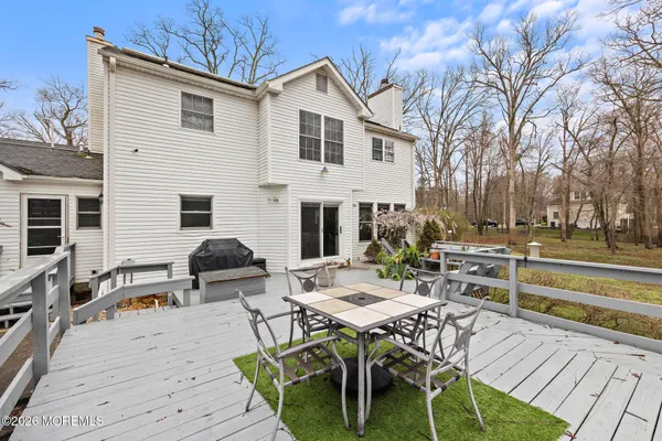 a view of a dinning table and chairs in the patio