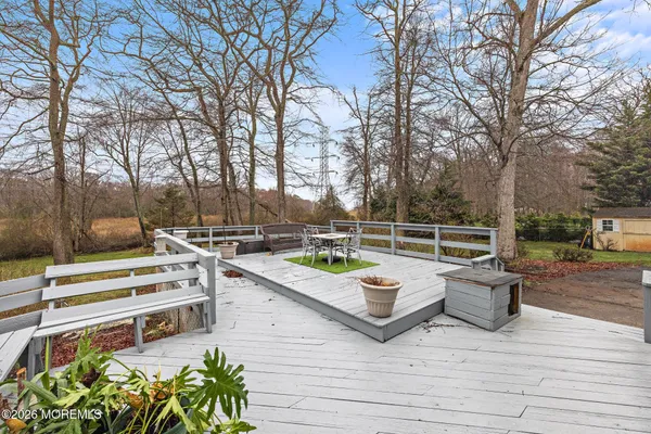 a view of a wooden deck and trees