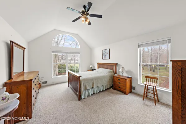 a bed room with a bed and a window