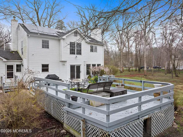 an aerial view of a house with a big yard