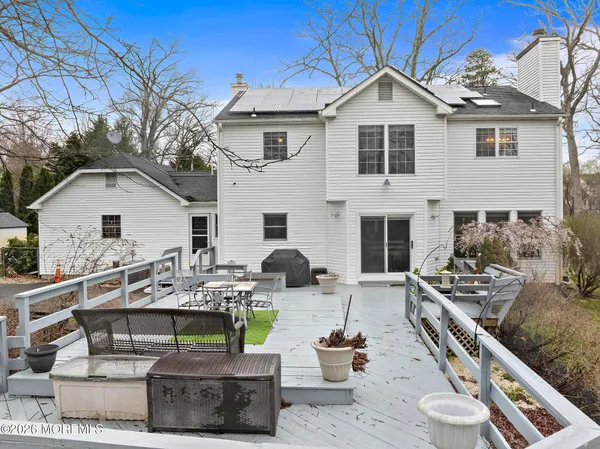 a front view of a house with yard and seating area