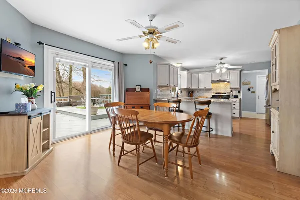 a view of a dining room with furniture window and outside view