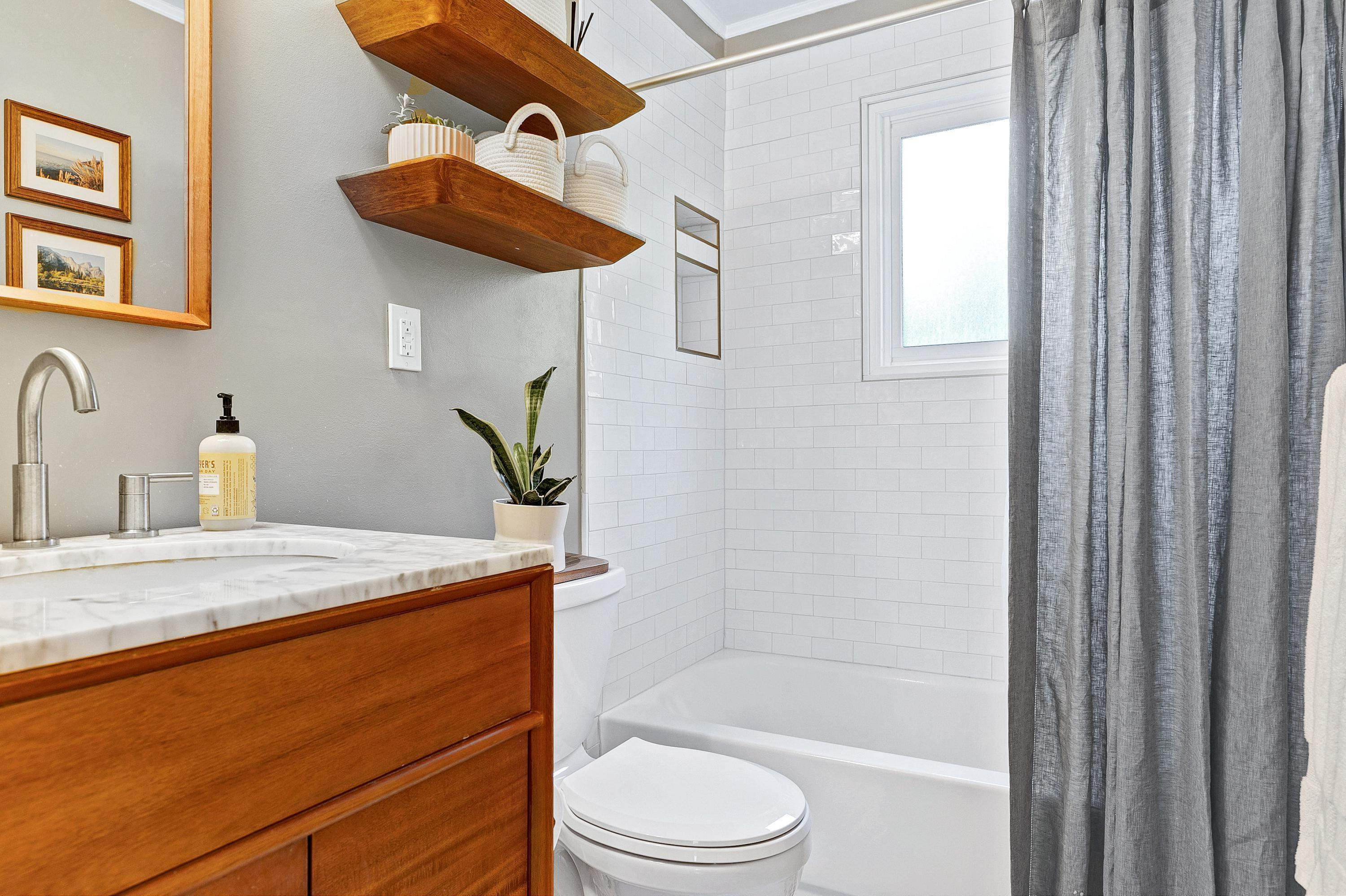 501 North King Charles Road Raleigh, NC 27610 - Photo 24 of 42 a bathroom with a granite countertop sink toilet and shower