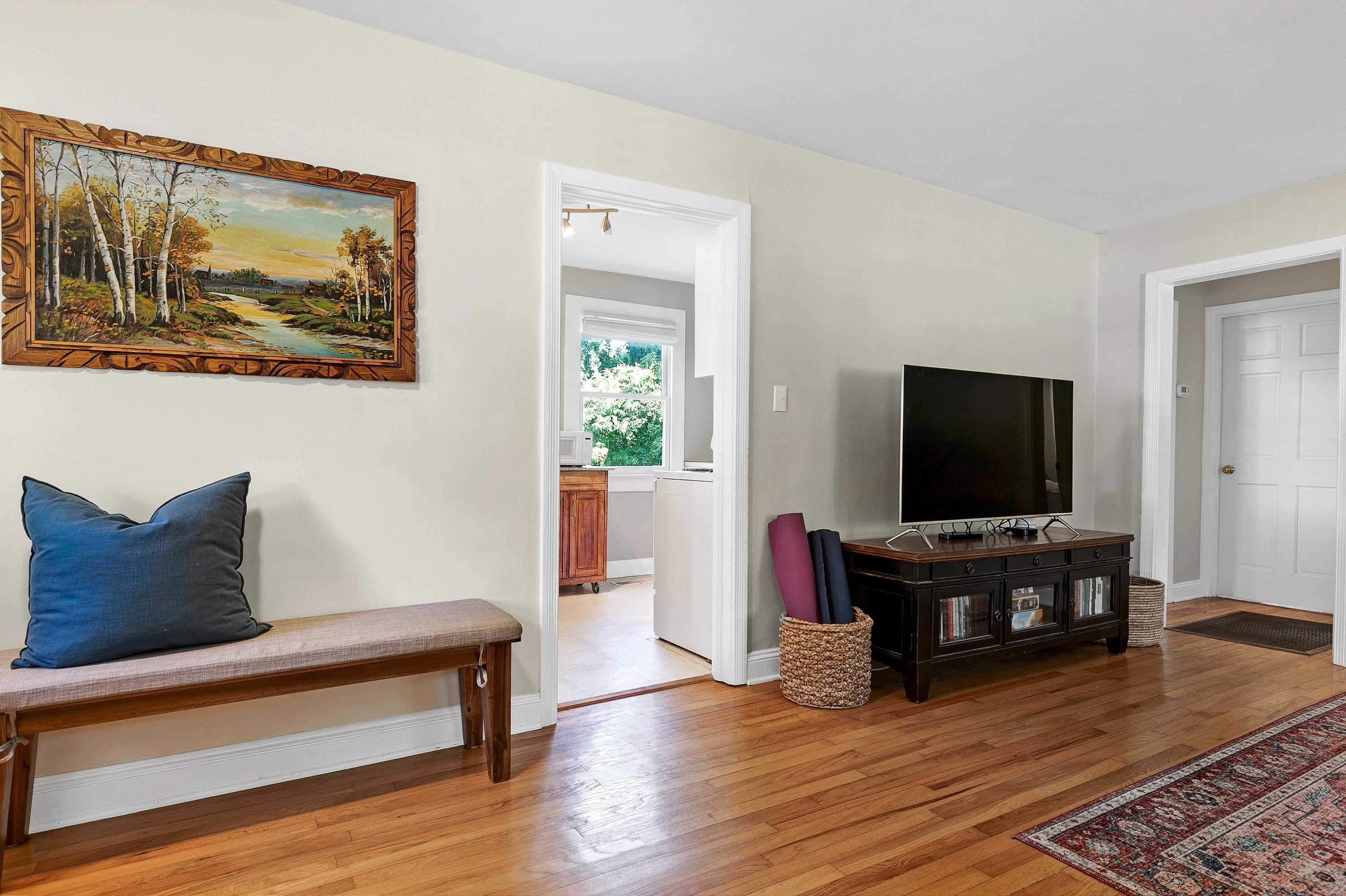 501 North King Charles Road Raleigh, NC 27610 - Photo 10 of 42 a living room with furniture and a flat screen tv