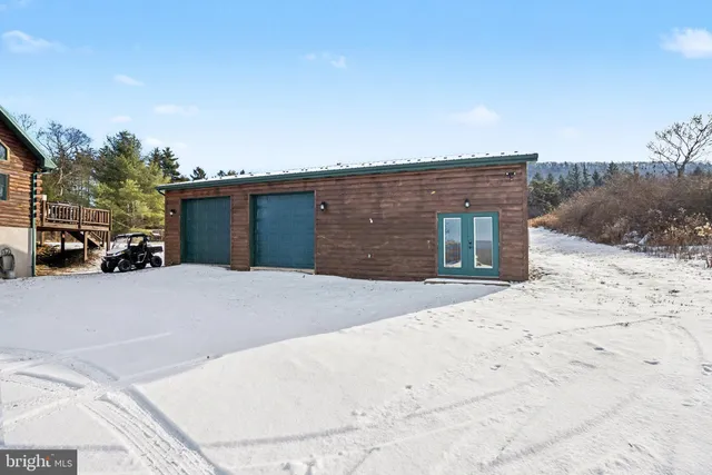 a view of a terrace with lawn chairs