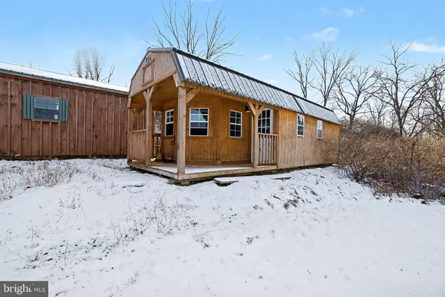 a view of a field with an trees