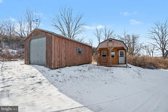 a view of a two chairs in a yard