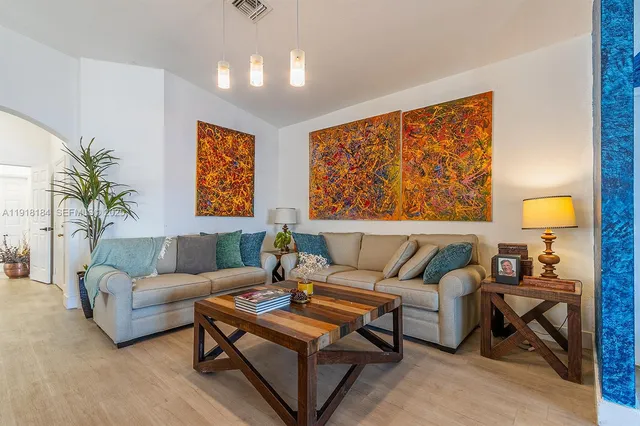 a living room with furniture and a flat screen tv