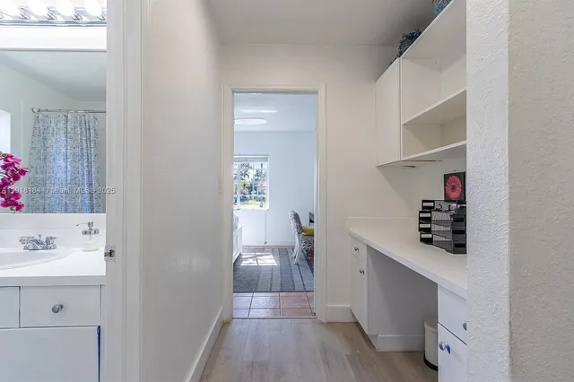 a view of a lake with houses in the back