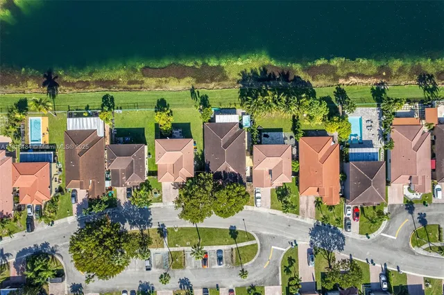a sign that is sitting on a wooden fence