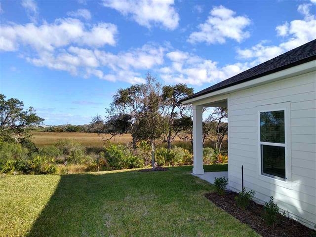 55 St Barts Avenue St. Augustine, FL 32080 - Photo 16 of 20 a view of a house with backyard and garden