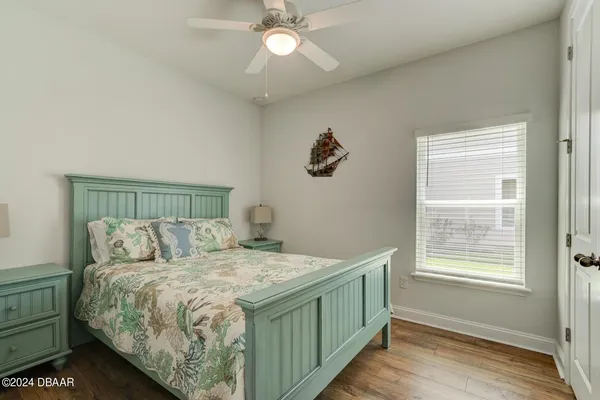 a bedroom with a bed and a rug