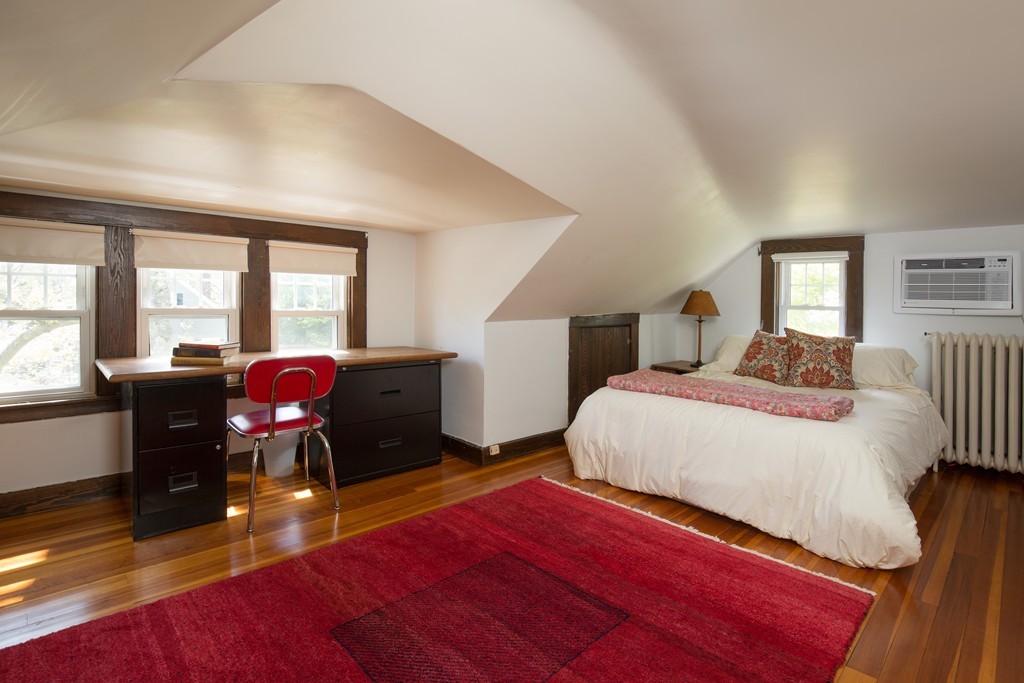 7 Homestead Road Wellesley, MA 02482 - Photo 8 of 10 a bedroom with a bed dresser and a large window