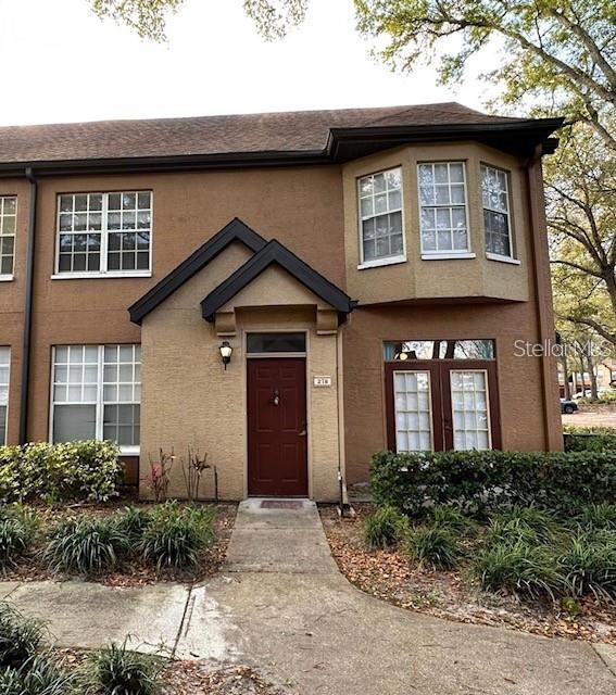 6388 Raleigh Street, Unit 2711 Orlando, FL 32835 - Photo 1 of 1 a front view of a house with garden