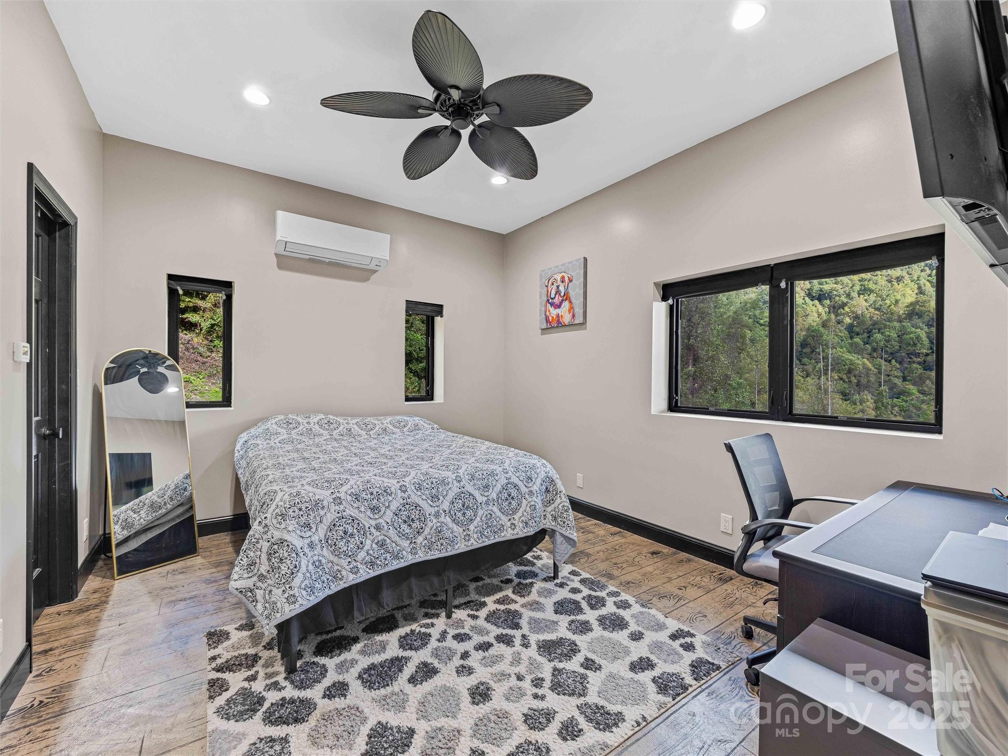 945 Roaring Fork Road Hot Springs, NC 28743 - Photo 12 of 48 a bedroom with a bed and a window