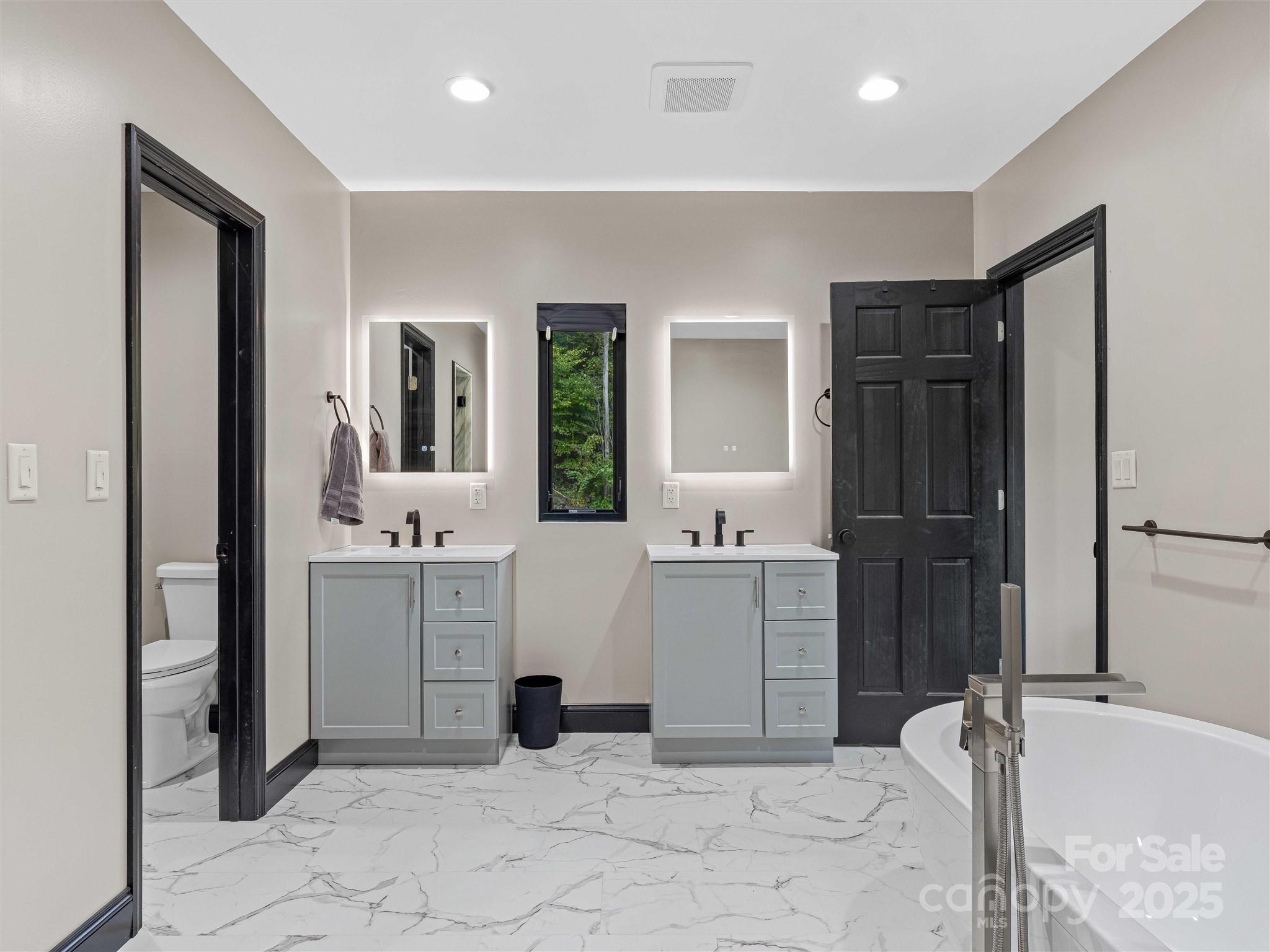 945 Roaring Fork Road Hot Springs, NC 28743 - Photo 16 of 48 a room with a dresser and mirror