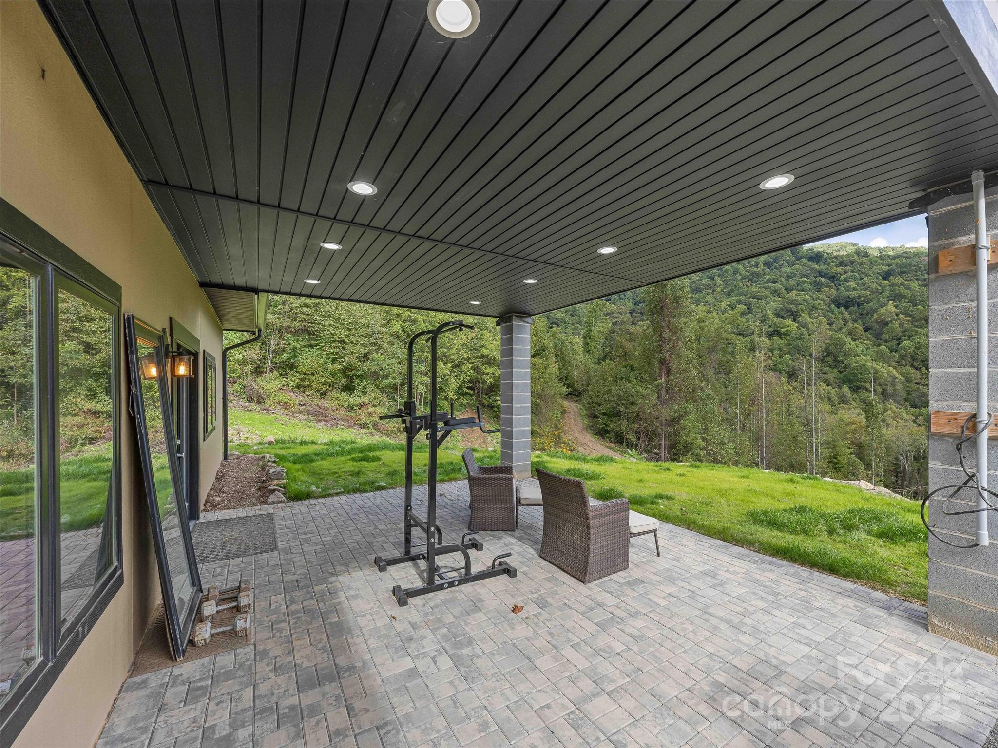 945 Roaring Fork Road Hot Springs, NC 28743 - Photo 21 of 48 a garden view with a seating space