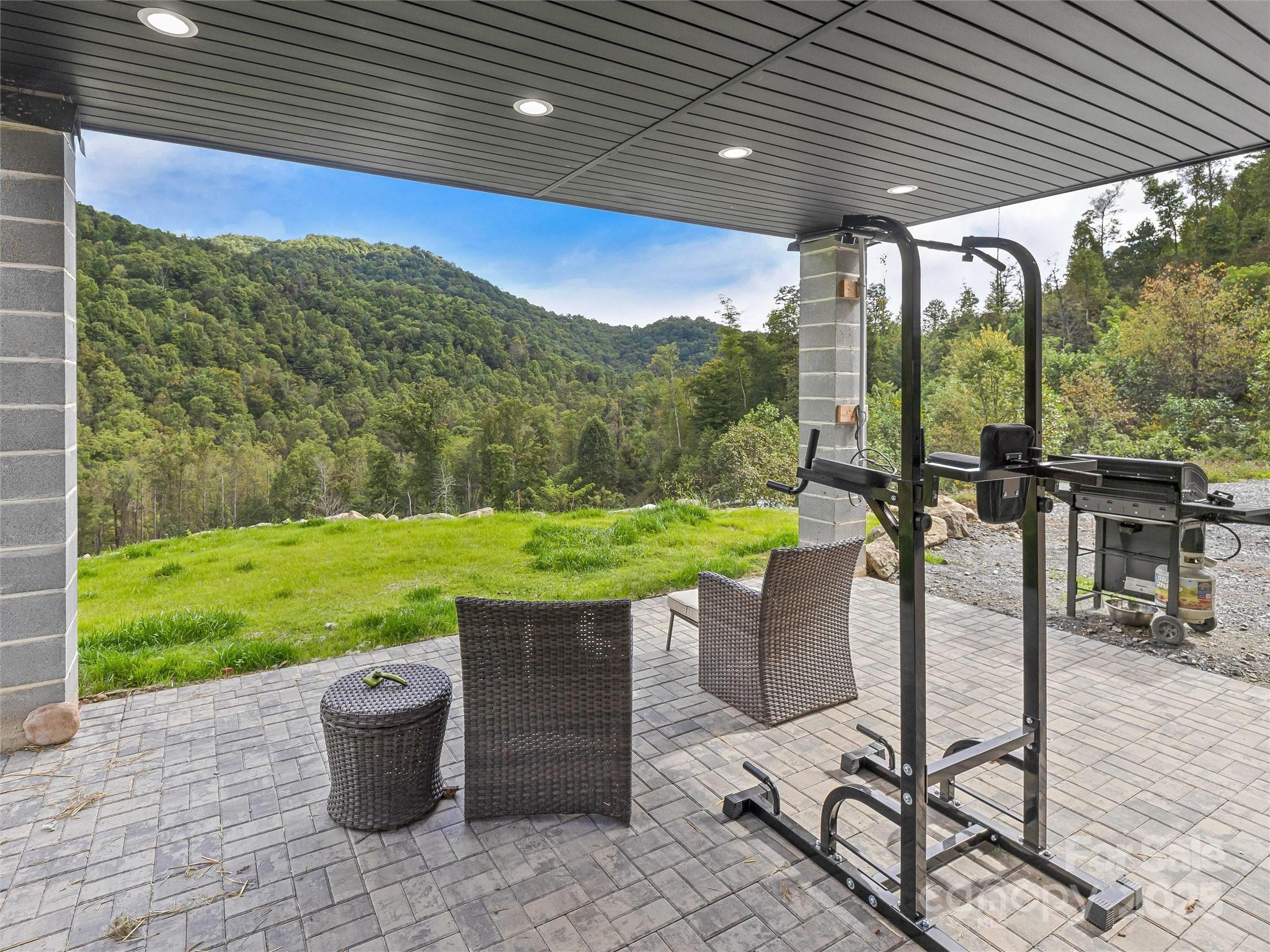 945 Roaring Fork Road Hot Springs, NC 28743 - Photo 22 of 48 a view of a porch with furniture and yard