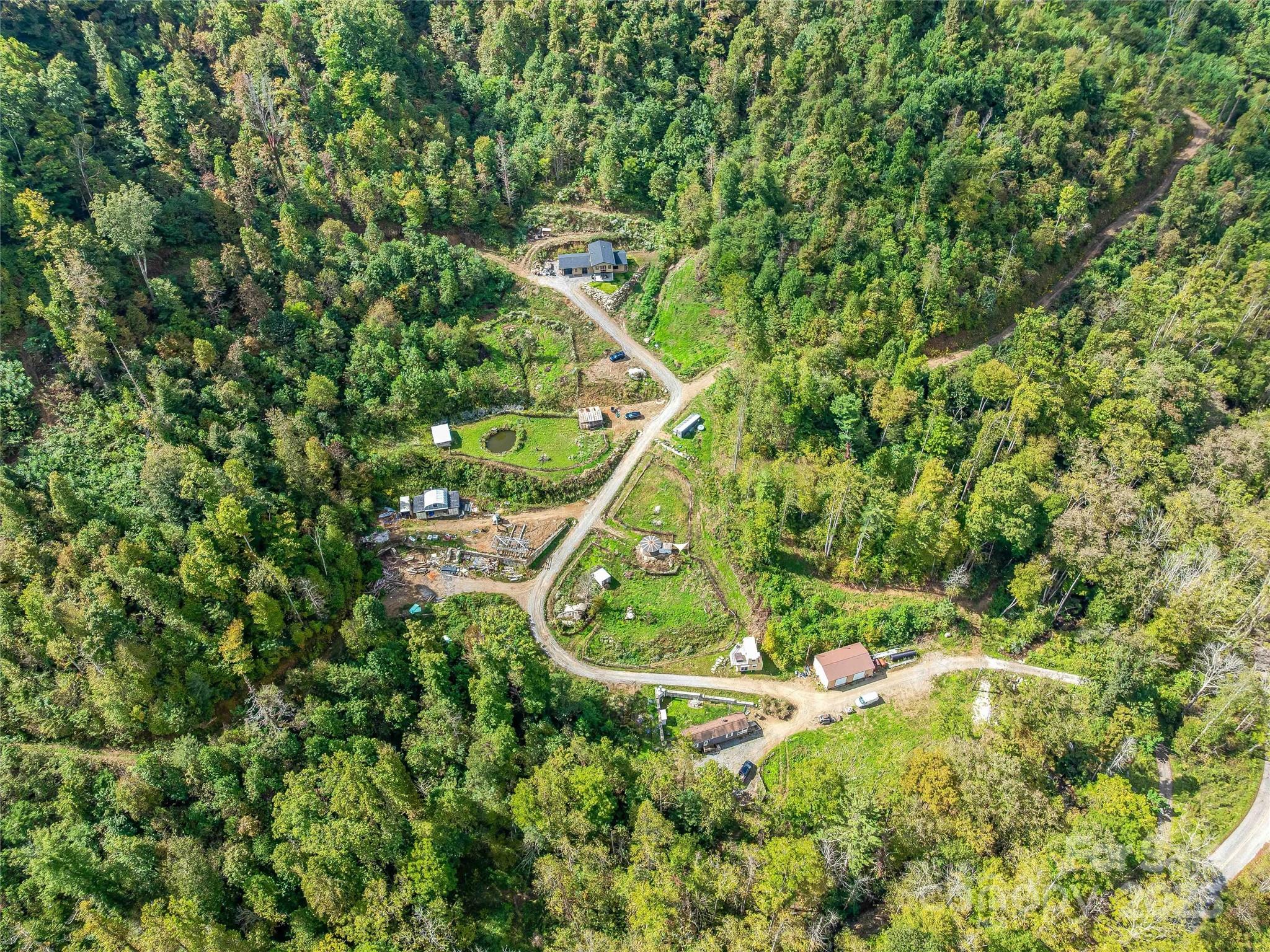 945 Roaring Fork Road Hot Springs, NC 28743 - Photo 23 of 48 a backyard of a house