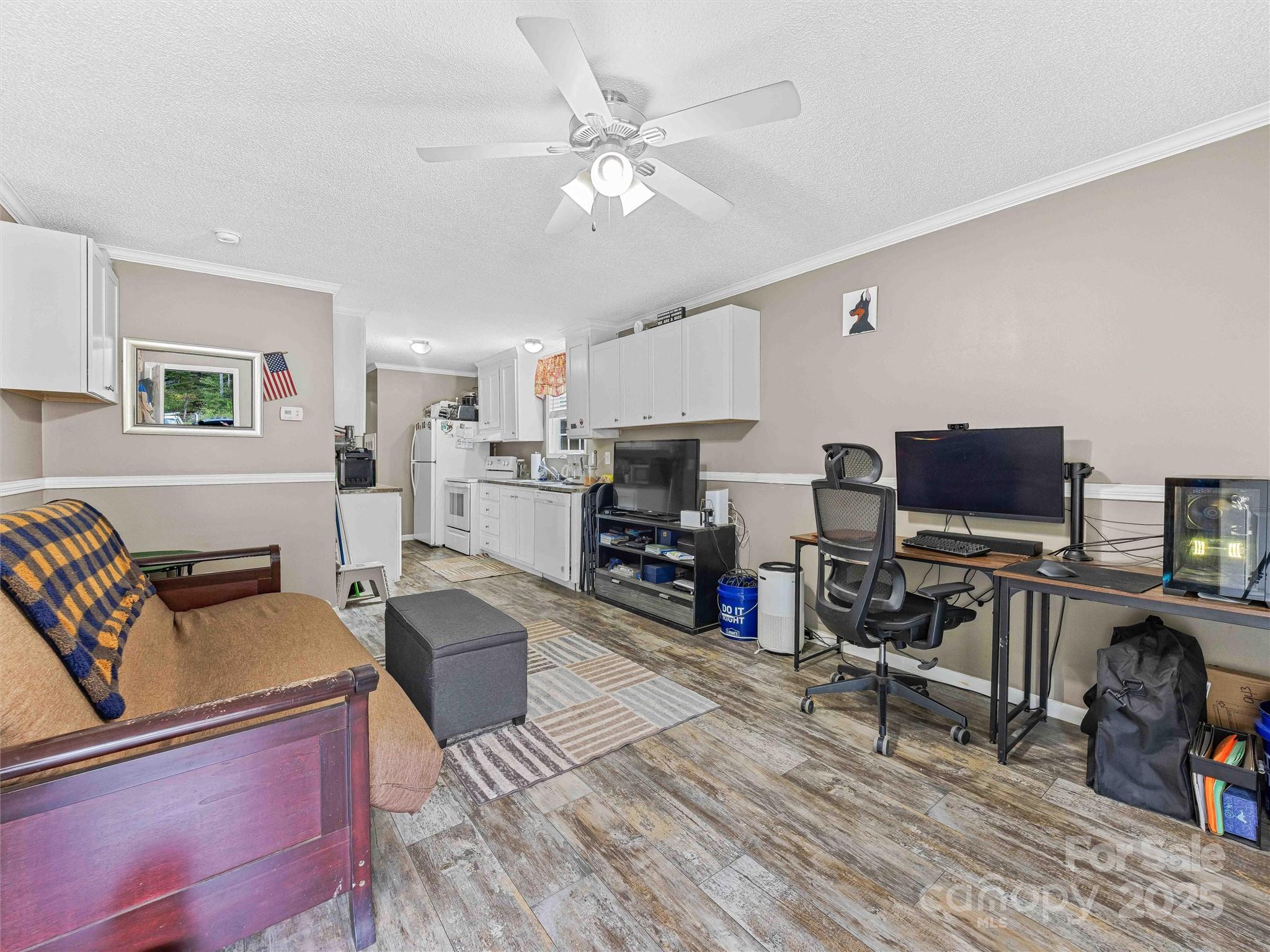 945 Roaring Fork Road Hot Springs, NC 28743 - Photo 28 of 48 a living room with furniture and a flat screen tv