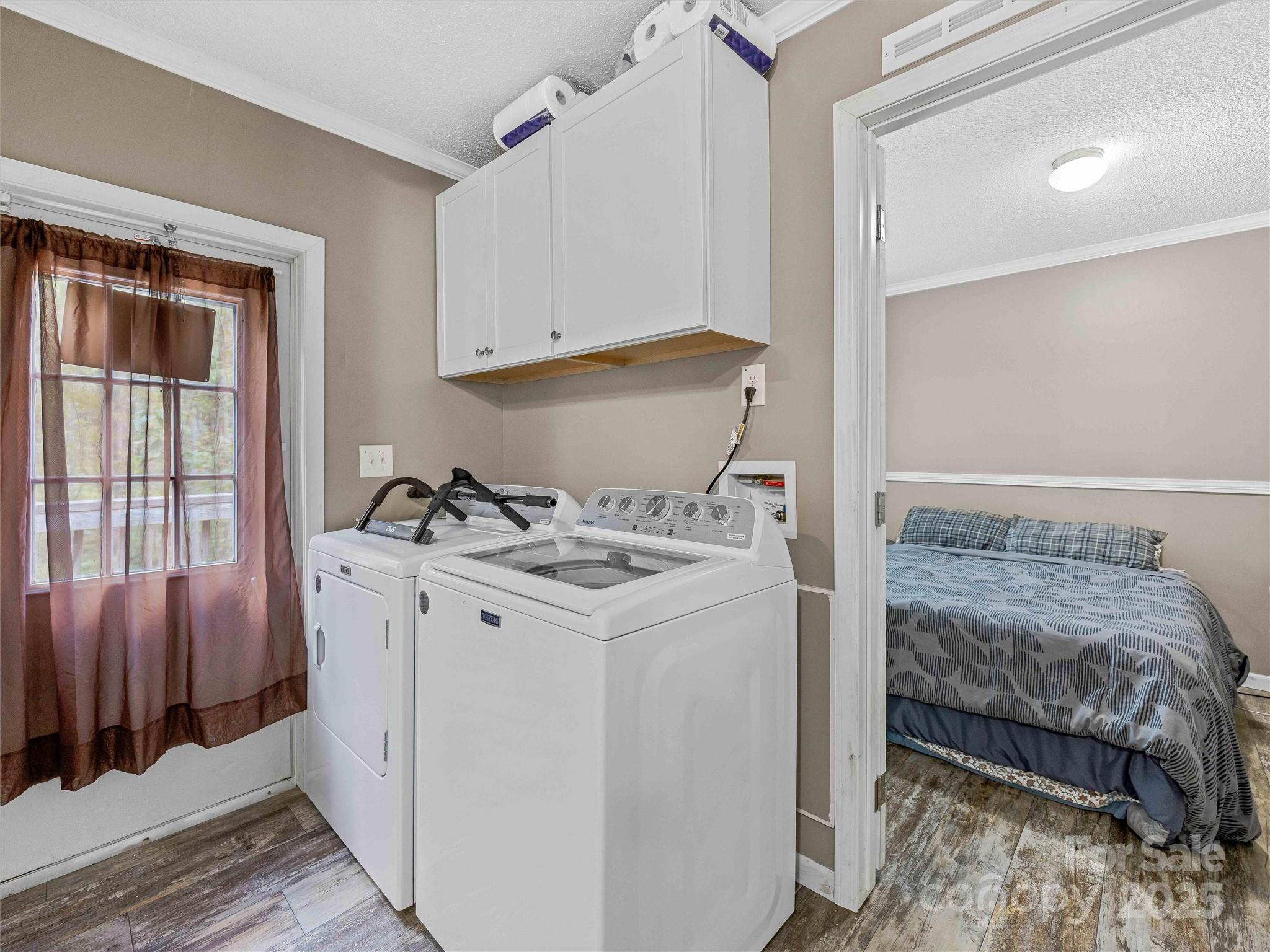 945 Roaring Fork Road Hot Springs, NC 28743 - Photo 29 of 48 a bedroom with a bed and a window