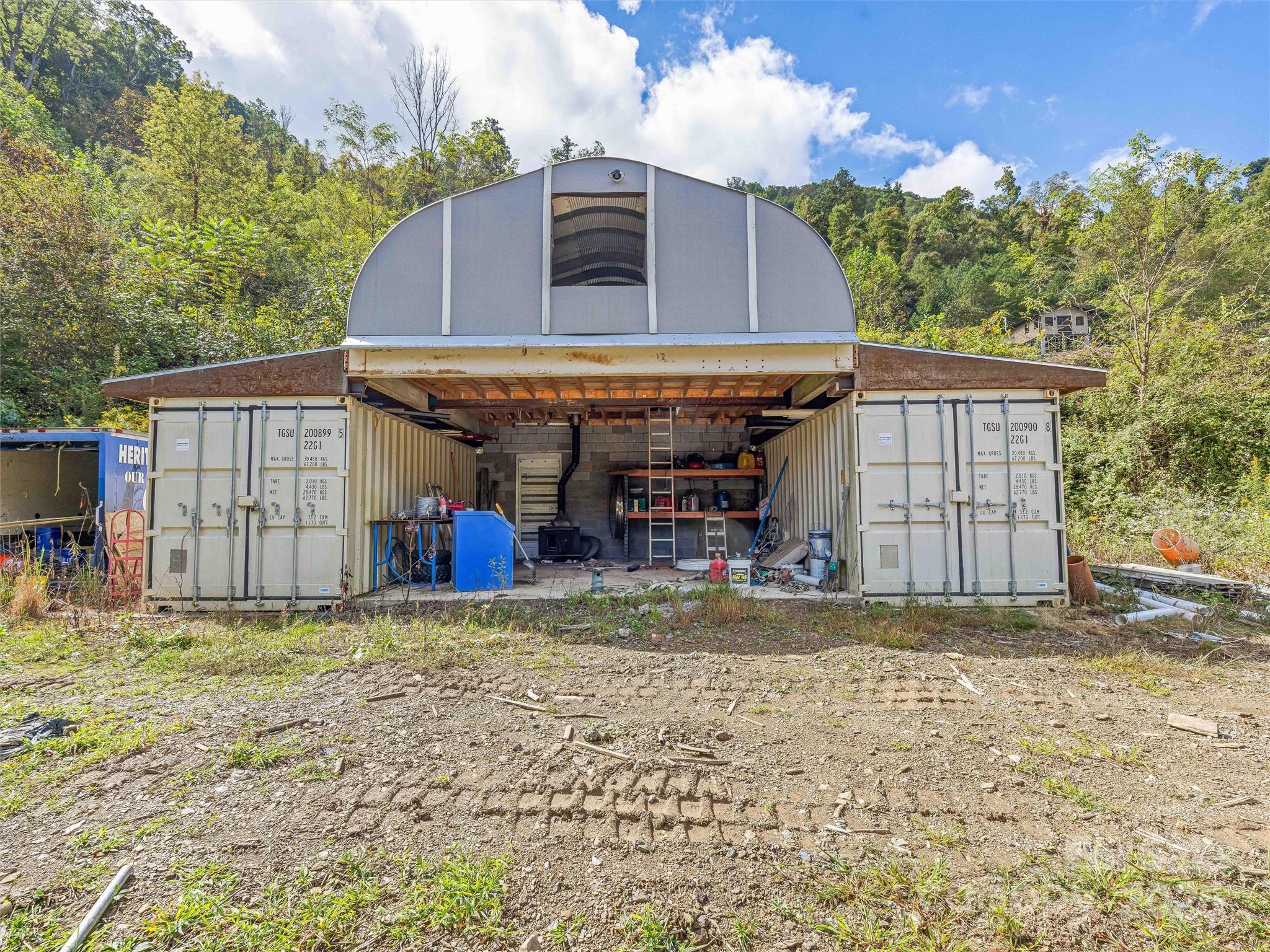 945 Roaring Fork Road Hot Springs, NC 28743 - Photo 39 of 48 a view of a house with a yard